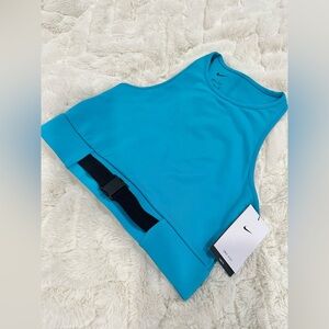 NWT Medium Cyber Teal Nike elastic workout top with buckle detail at the hem